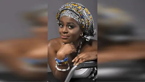 Ernest Simons Photography Linda Gyamfi in a headscarf and jewellery