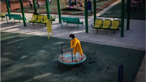 Getty Images A primary school student plays in a public park in Hong Kong