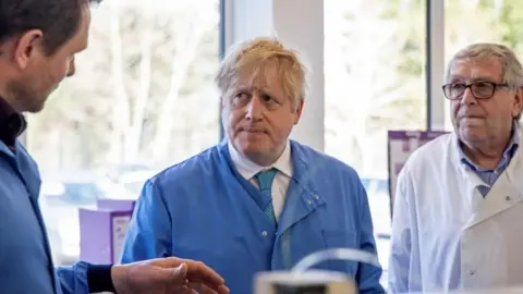 Getty Images Prime Minister Boris Johnson visits to the Mologic Laboratory in the Bedford technology Park, north of London