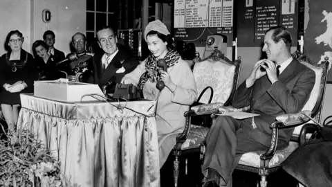 PA Media A black and white photo of the Queen and the Duke of Edinburgh