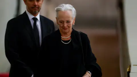 PA Media Queen Margrethe and the Crown Prince Frederik view Queen Elizabeth's coffin at her lying-in-state