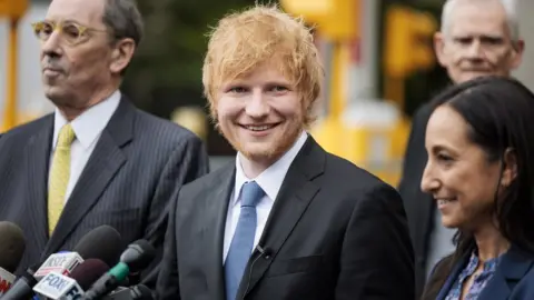 EPA Musician Ed Sheeran (C) smiles while standing with his legal team after winning his copyright infringement case in New York, New York, USA, 04 May 2023