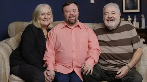 Liam McBurney Belfast actor James Martin, pictured with his parents Suzanne and Ivan