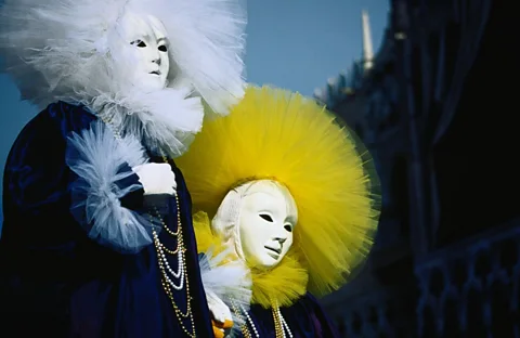 Don a mask and costume to blend in at the lavish parades, masquerade balls, and spontaneous street parties. (Juliet Coombe/LPI)