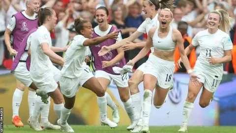 Getty Images Chloe Kelly celebrates scoring England's winner against Germany in the Euro 2022 final at Wembley