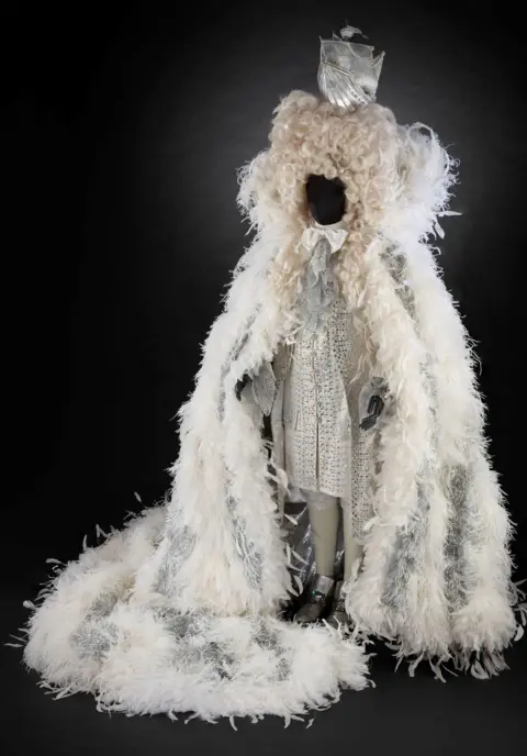 V&A Sir Elton John 50th birthday look with wig and boat hat, designed by Sandy Powell, 1997