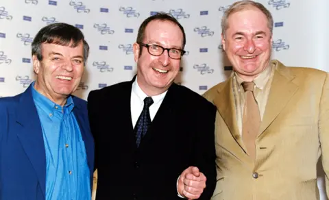 PA Media File photo dated 18/03/02 of Radio DJ's Tony Blackburn (left), Steve Wright and Paul Gambaccini during the Sony Radio Awards launch party at the Commonwealth Club in London.