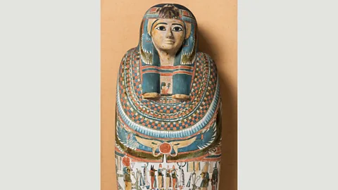 Two Temple Place/Macclesfield Museum Elaborate sarcophagi depict faces with heavy eye-liner – but make-up for the ancient Egyptians was functional as well as aesthetic (Credit: Two Temple Place/Macclesfield Museum)