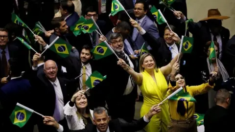 Reuters Supporters of the reform celebrated when it was approved in the lower house