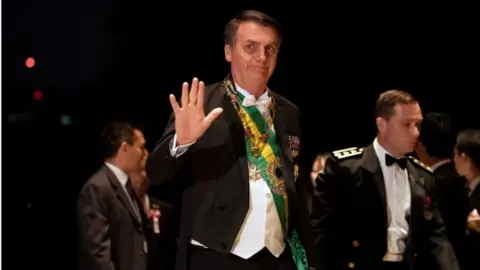 Reuters President Jair Bolsonaro arrives at the Imperial Palace for the Court Banquets after the Ceremony of the Enthronement of Emperor Naruhito in Tokyo, Japan October 22, 2019.