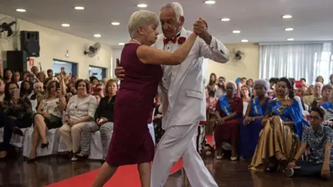 Getty Images Pensioners dance at a beauty pageant for elderly women ahead of Mother's Day, in Sao Paulo, Brazil on May 10, 2018